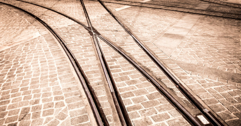 Contract breach represented by train tracks diverging
