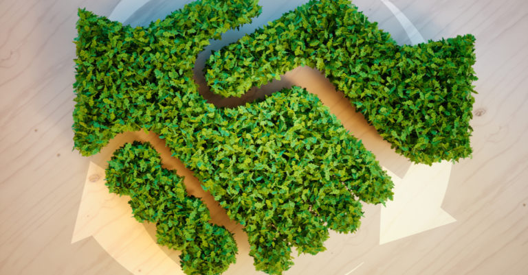 Sustainable procurement represented by hands made of leaves shaking in agreement