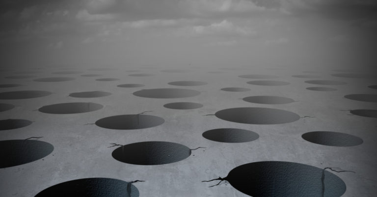 Top 10 pitfalls represented by potholes in the ground
