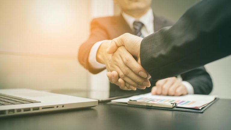 Embrace contract management symbolized by shaking hands