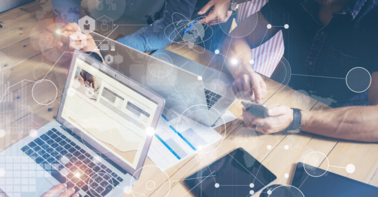 Contracts in the digital age represented by people working on computers