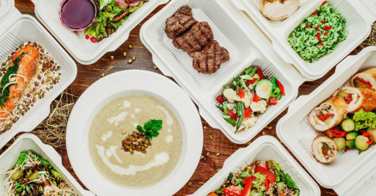 Customer spotlight on Just Eat represented by takeout boxes of food