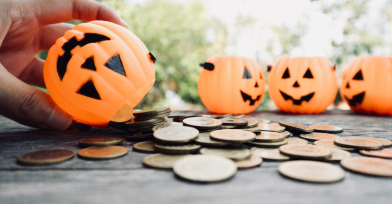 Pumpkins with coins representing money saved with a contract management platform