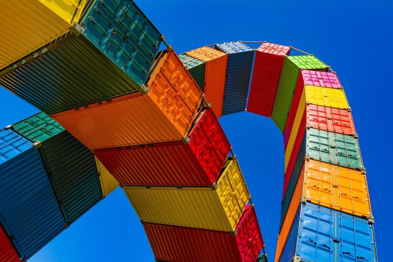 Arch of multi-colored cargo-container boxes. What is a Procurement Specialist?