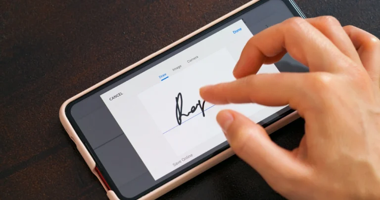 Person creating an e-signature on a smartphone.